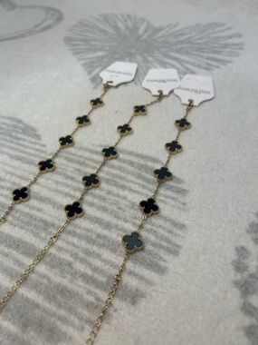 ONLY 1 black and gold stainless steel clover bracelet